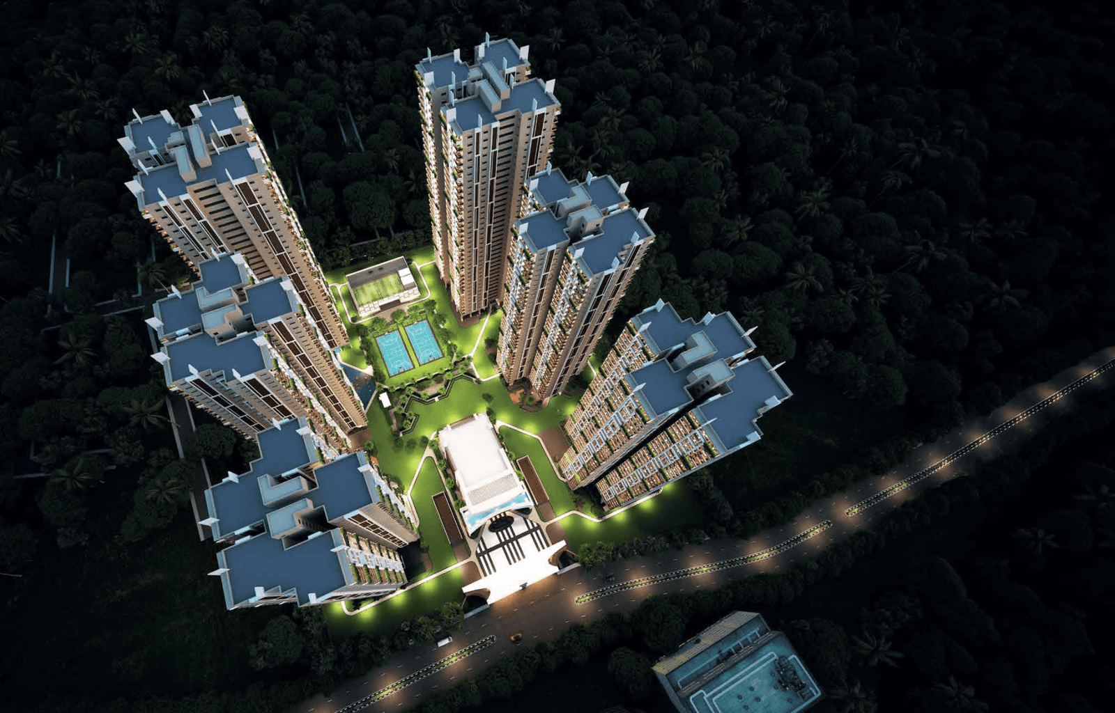 "Gamya residential towers illuminated at night, showcasing modern architecture and integrated green spaces"