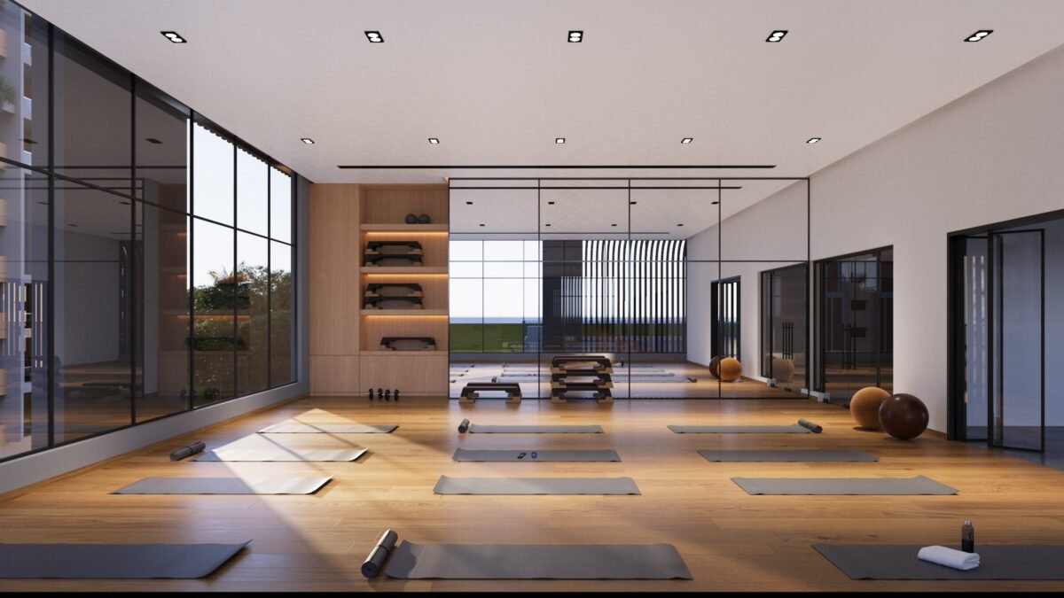 "Spacious and well-lit aerobics and yoga room with wooden flooring at Gamya by Supadha."