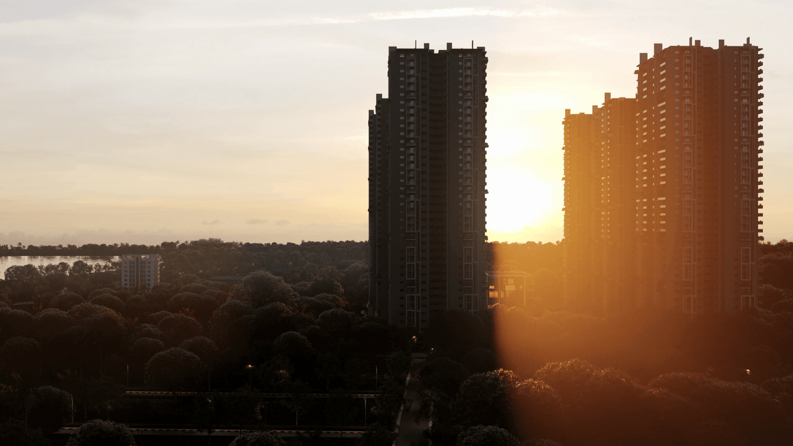 “Supadha Gamya high-rise buildings at sunset”