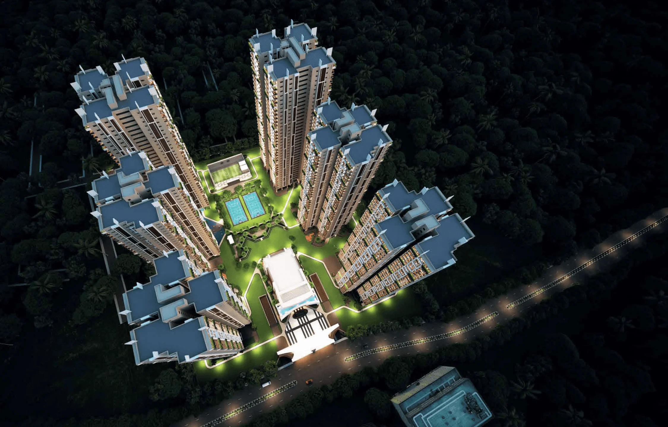 "Gamya residential towers illuminated at night, showcasing modern architecture and integrated green spaces"